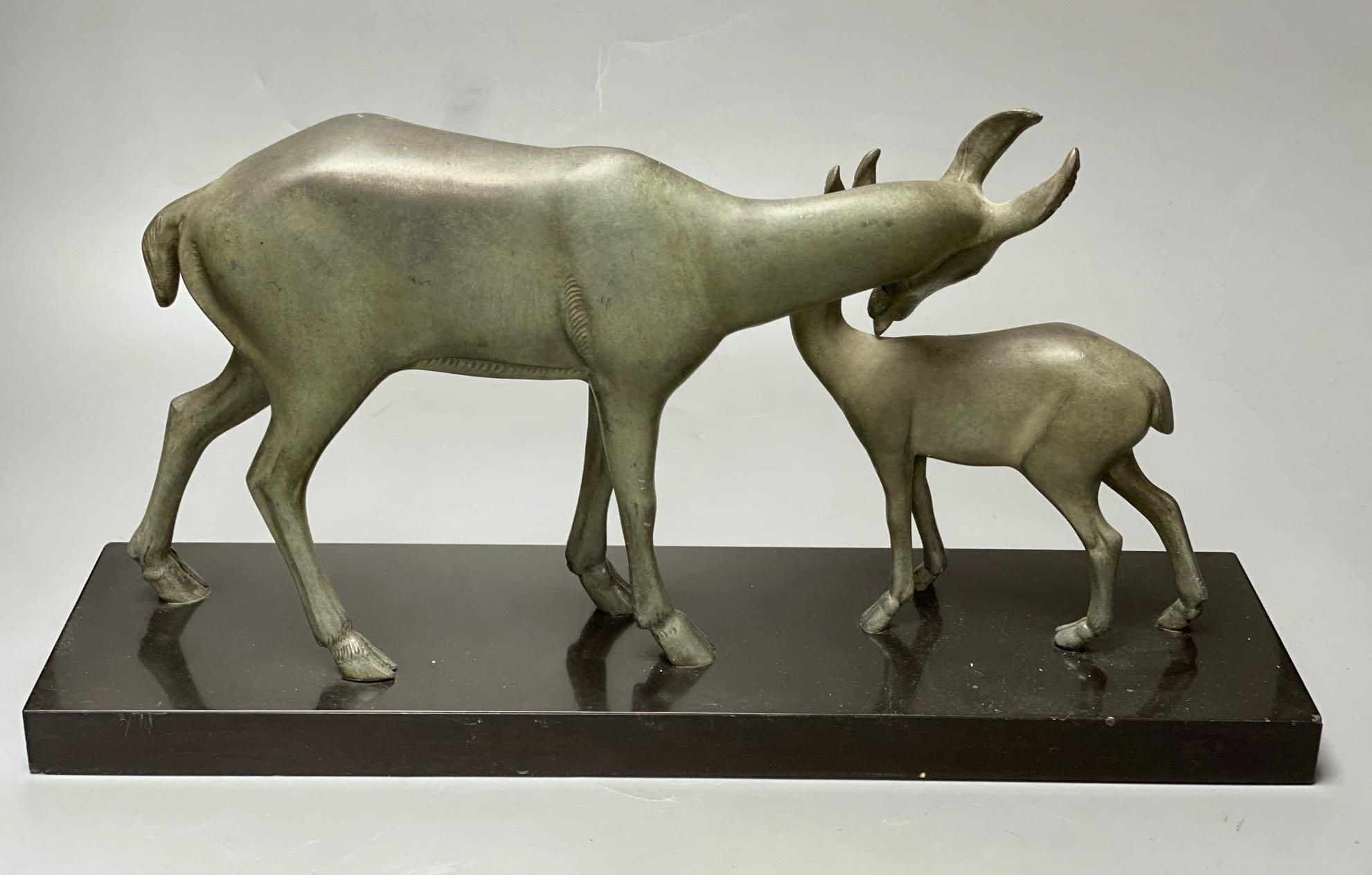 An Art Deco-style spelter deer group on slate plinth, 45cm, a mineral menu holder and a further mineral ornament